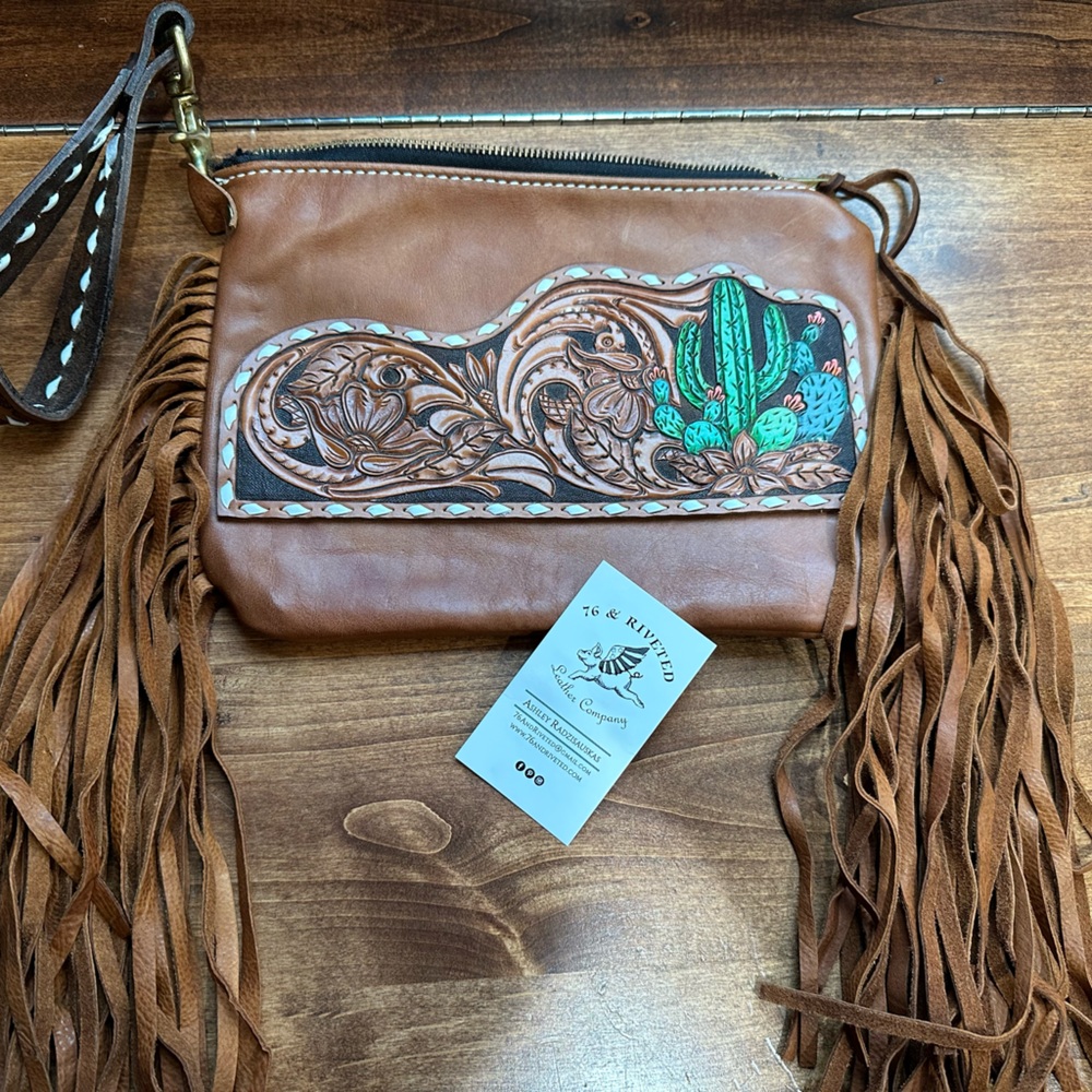 76 & Riveted leather custom tooled bag